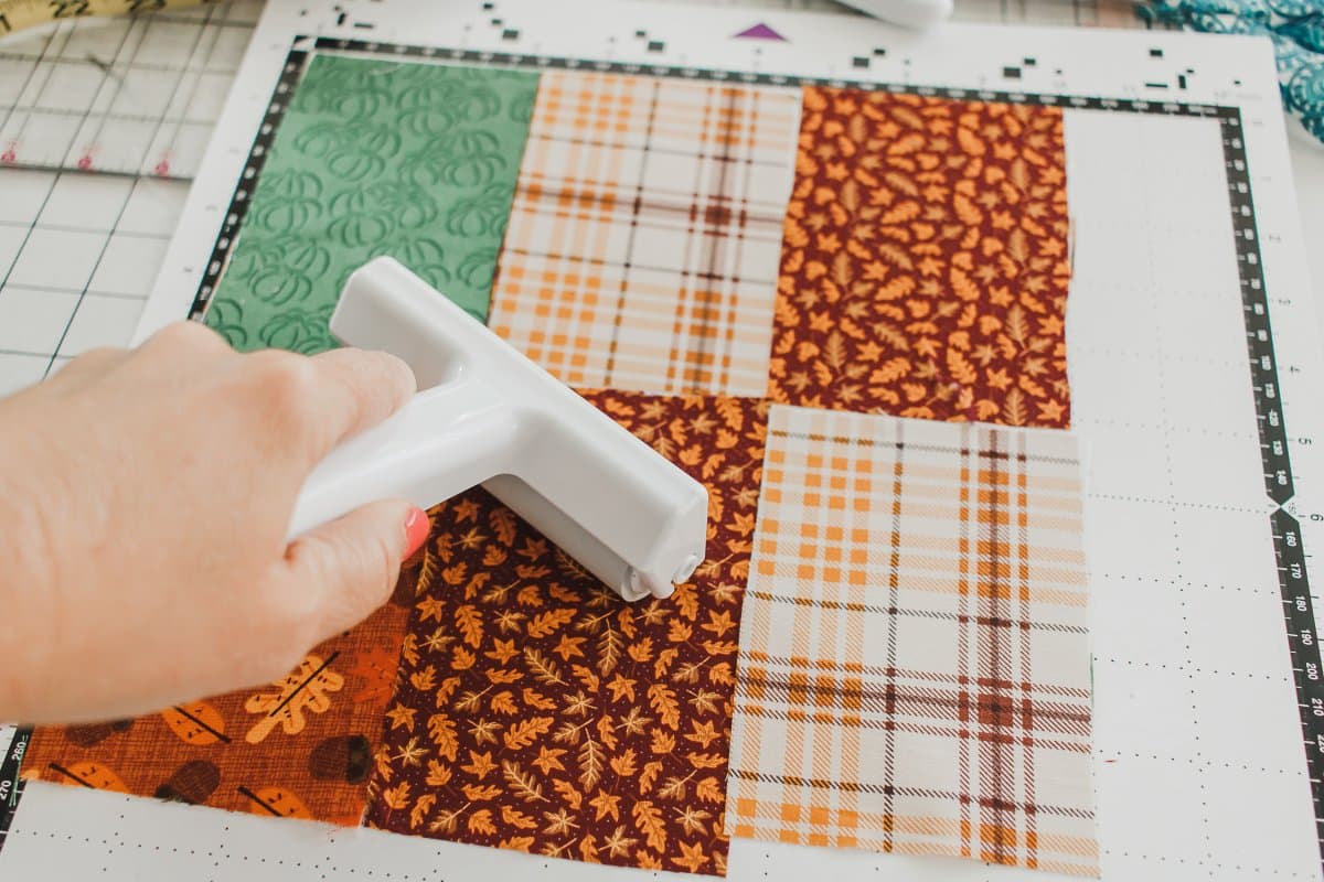 add fabric to cutting mat