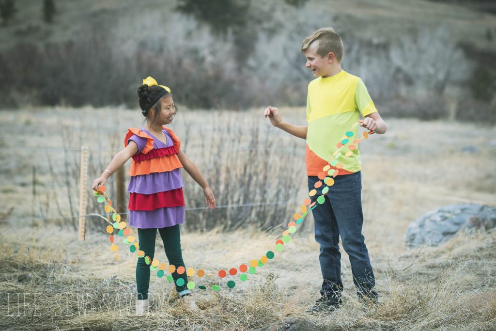 high five in colorful shirts