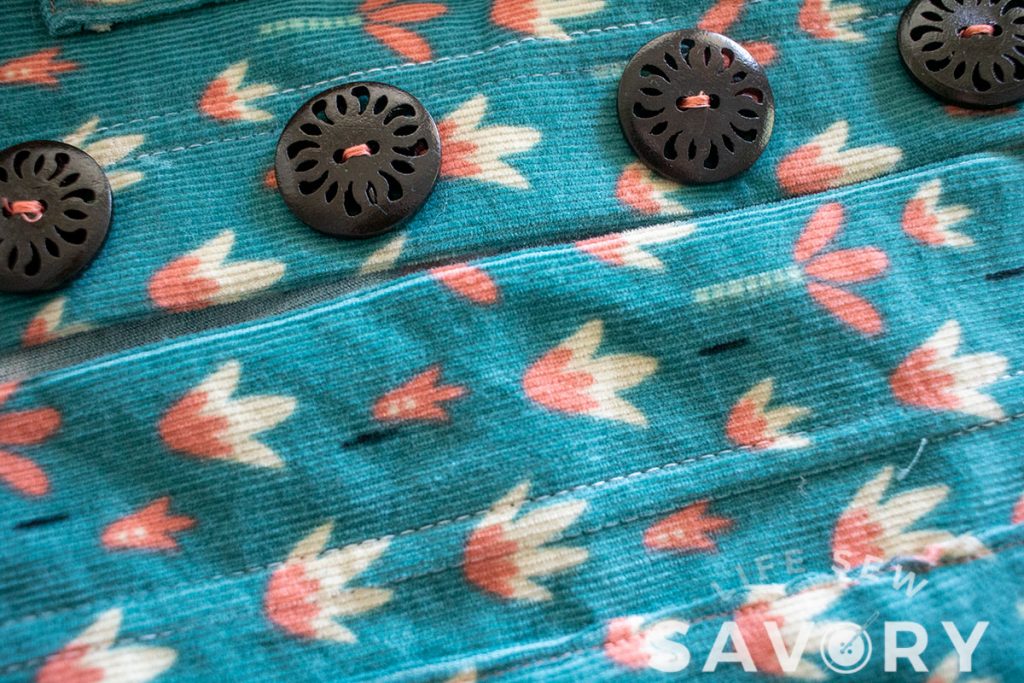 sew on buttons and mark holes