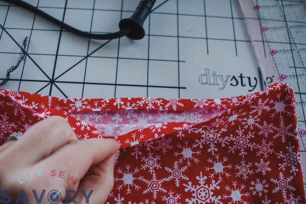 turn under the seam allowance for apron pocket