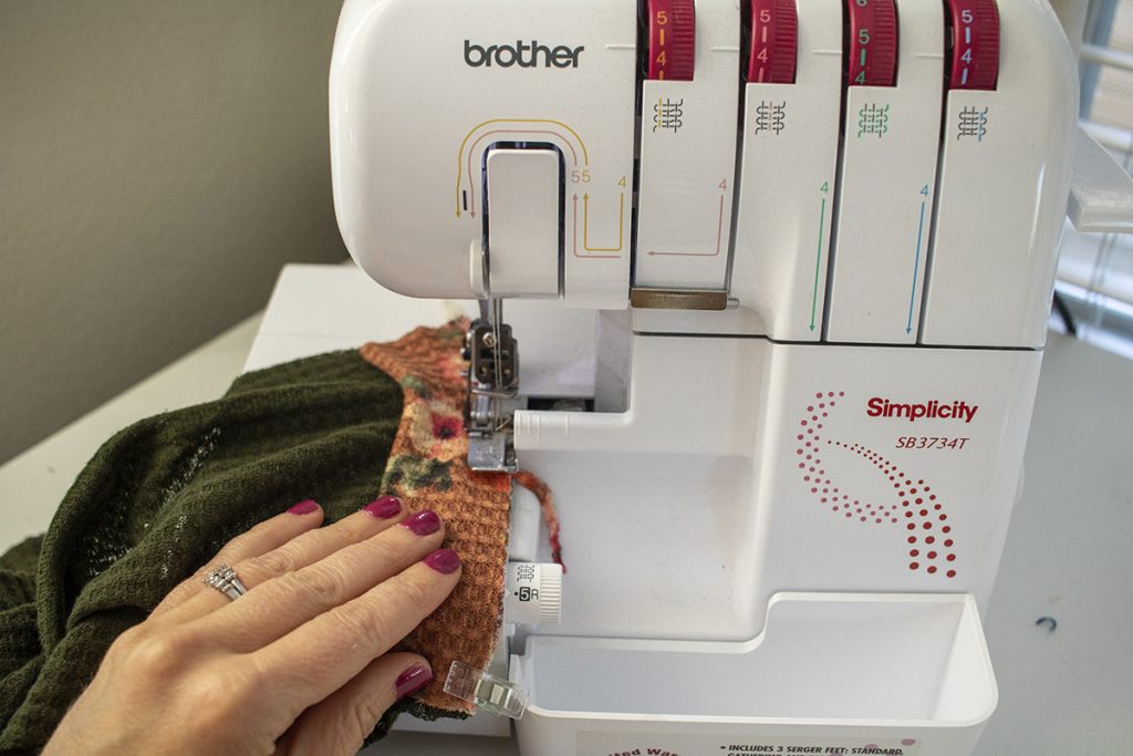 Sew cuff to sleeve with serger or stretch stitch