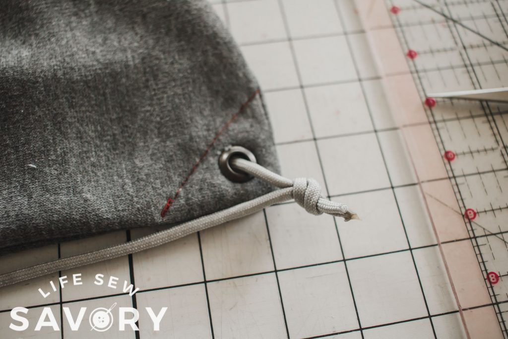 tie string through grommet to secure