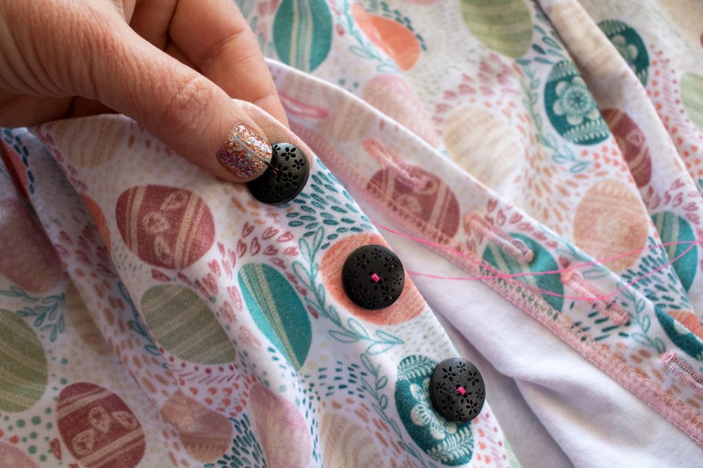 sew buttons to front