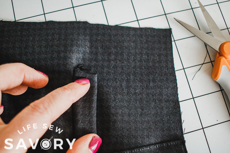 fold faux pocket up and sew sides to secure