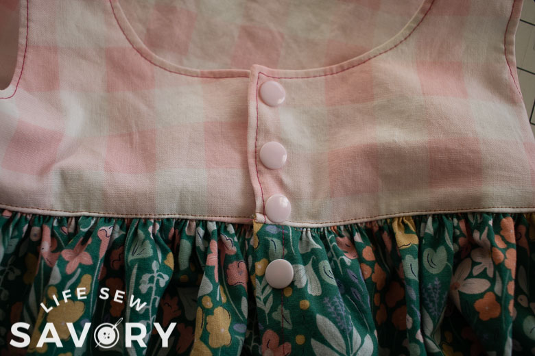 add four buttons or snaps