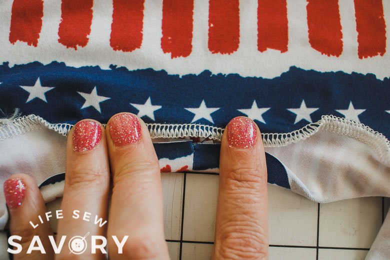 fold raw edge towards seam