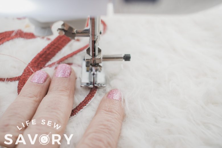 sew embroidery to pillow keeping fur away from stitches
