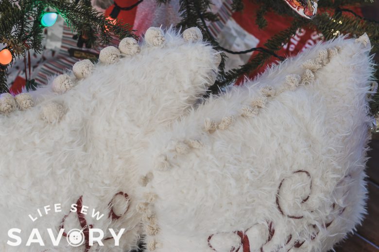 how to add pom poms to a diy pillow