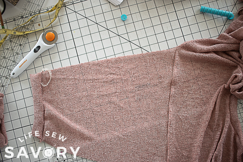 sleeve sewn to shirt