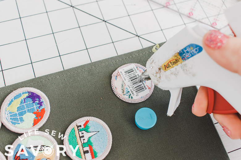 use a dot of hot glue to position badges