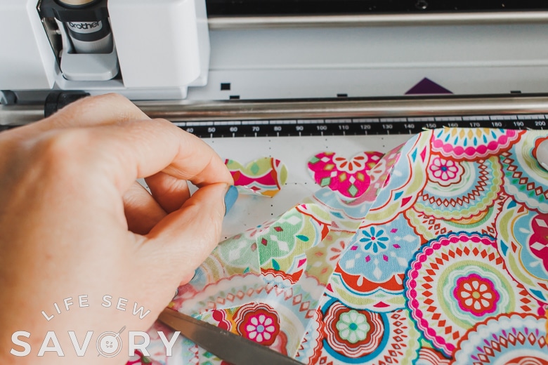 peel fabric to expose cut hearts