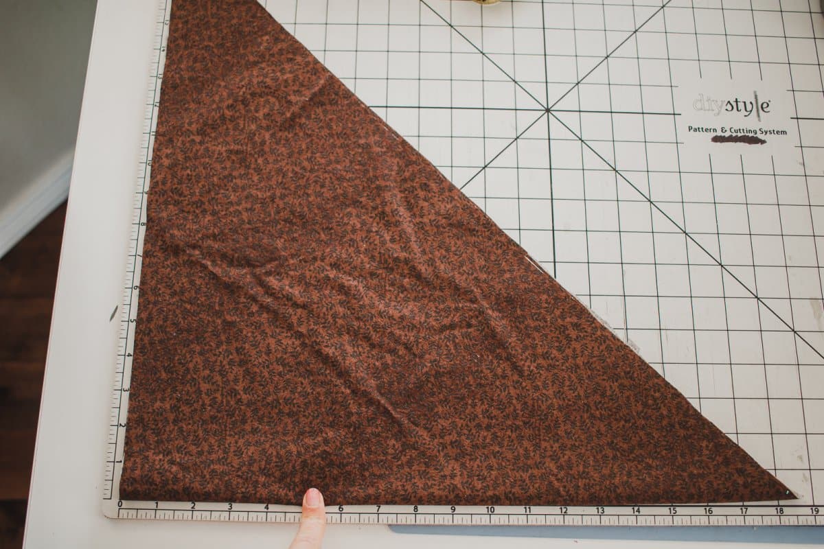 fold and cut fabric to create long pieces for bias tape