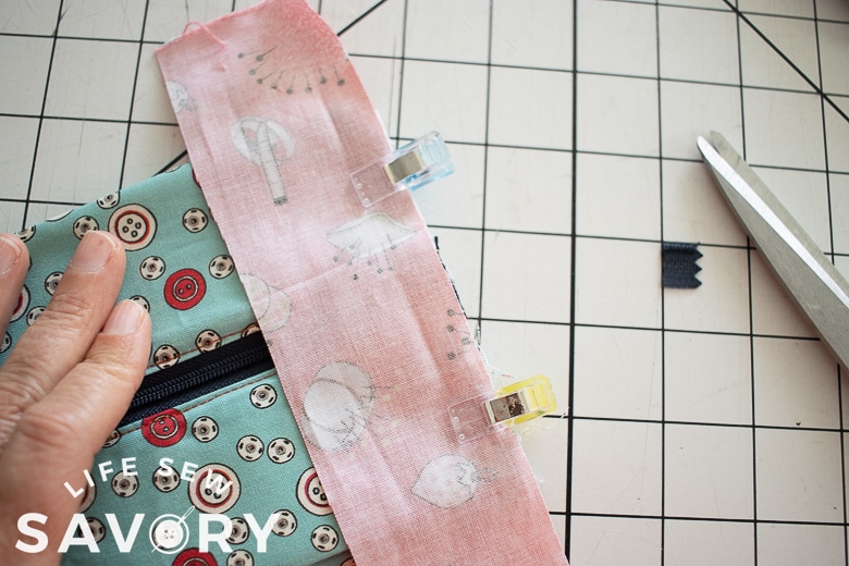 place fabric lined up with raw edge