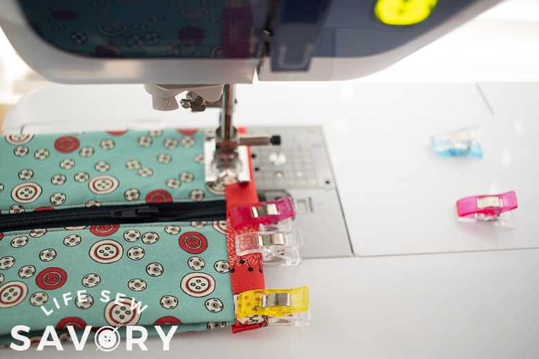 sew end to secure the end fabric be careful over zipper