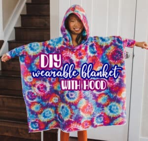 Learn how to sew an easy DIY wearable blanket in any size. This tutorial also includes a free hood pattern to add to your wearable blanket to make it a hoodie.