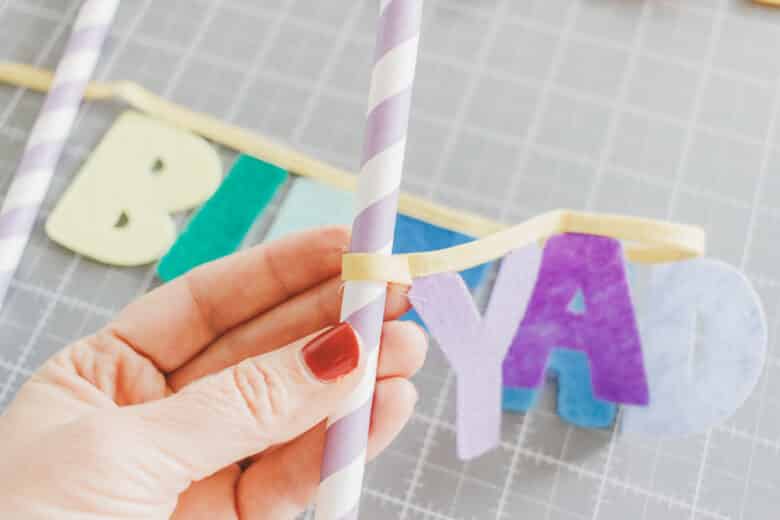 glue or tie ribbon to stra