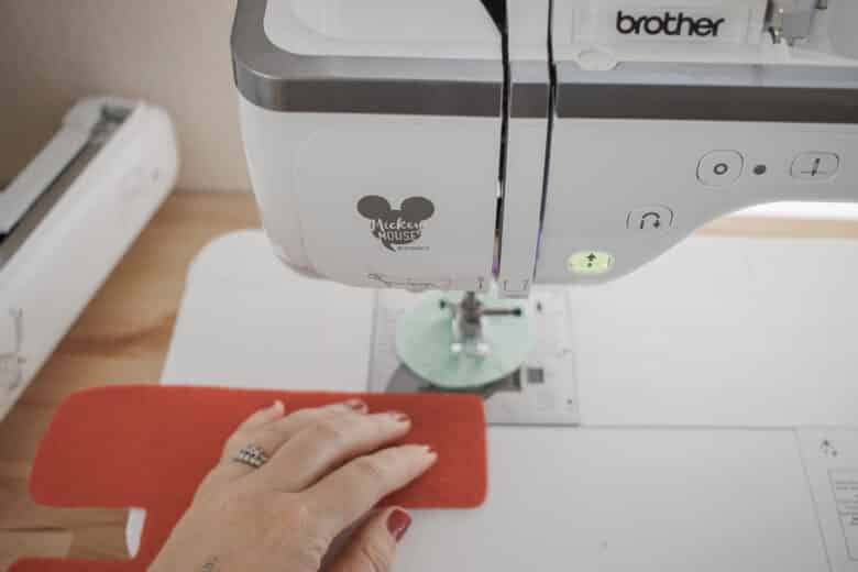 sew the letters and circles together with a straight stitch