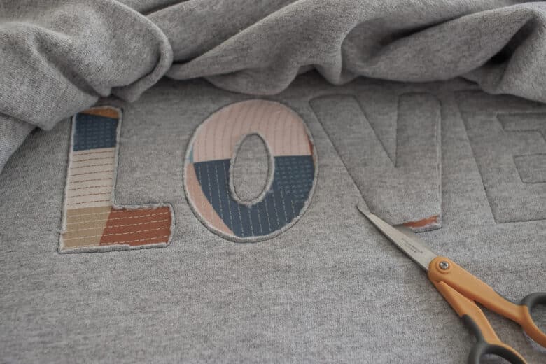 cut letters out of sweatshirt