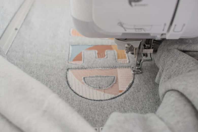 place hoop back on machine and finish embroidery