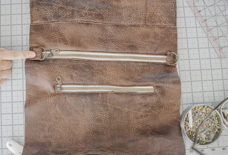 pin d-ring straps to sides of zipper