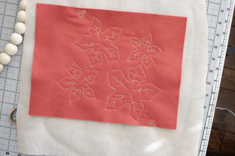 repeat with flower on red felt