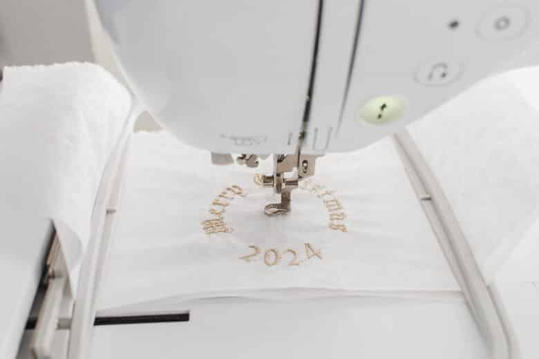 embroider design onto cloth and a stabilizer