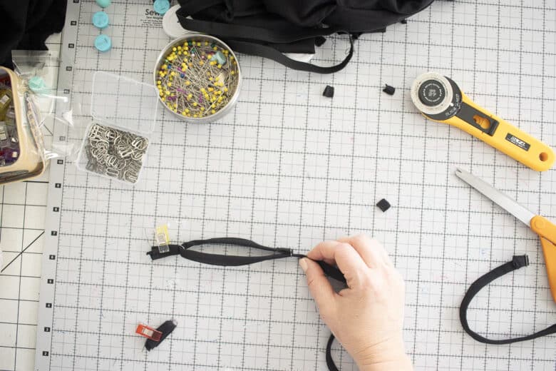 slide back through slider to make adjustable strap