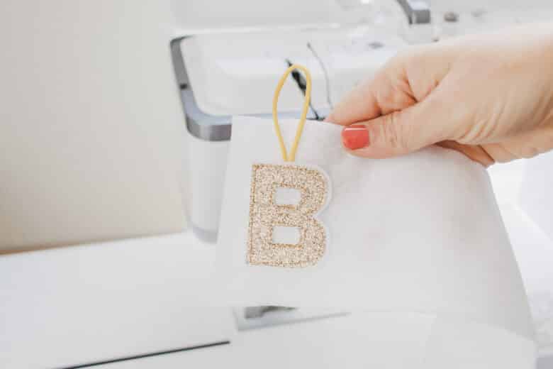 letter sewn onto felt