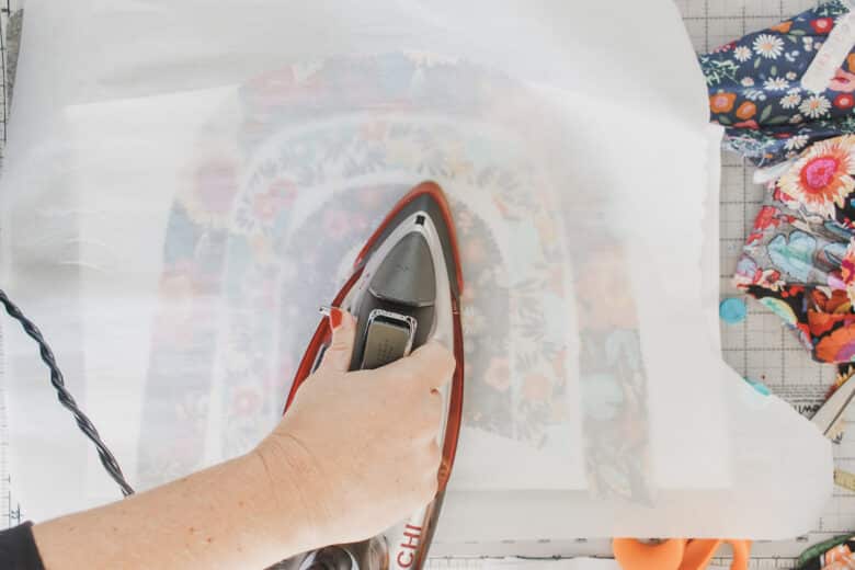 use a piece of parchment to protect your iron from fusible