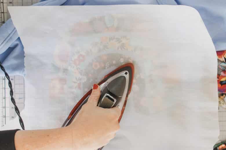 place parchment on top again and press to shirt
