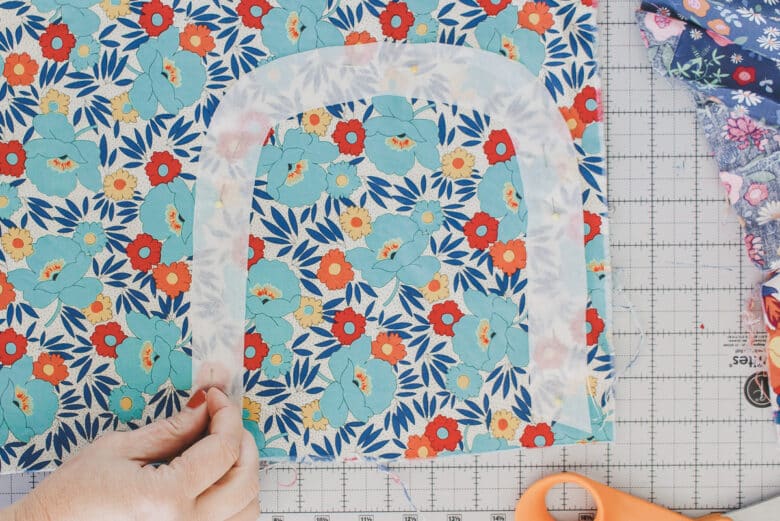 cut all layers of the rainbow design with the fabric