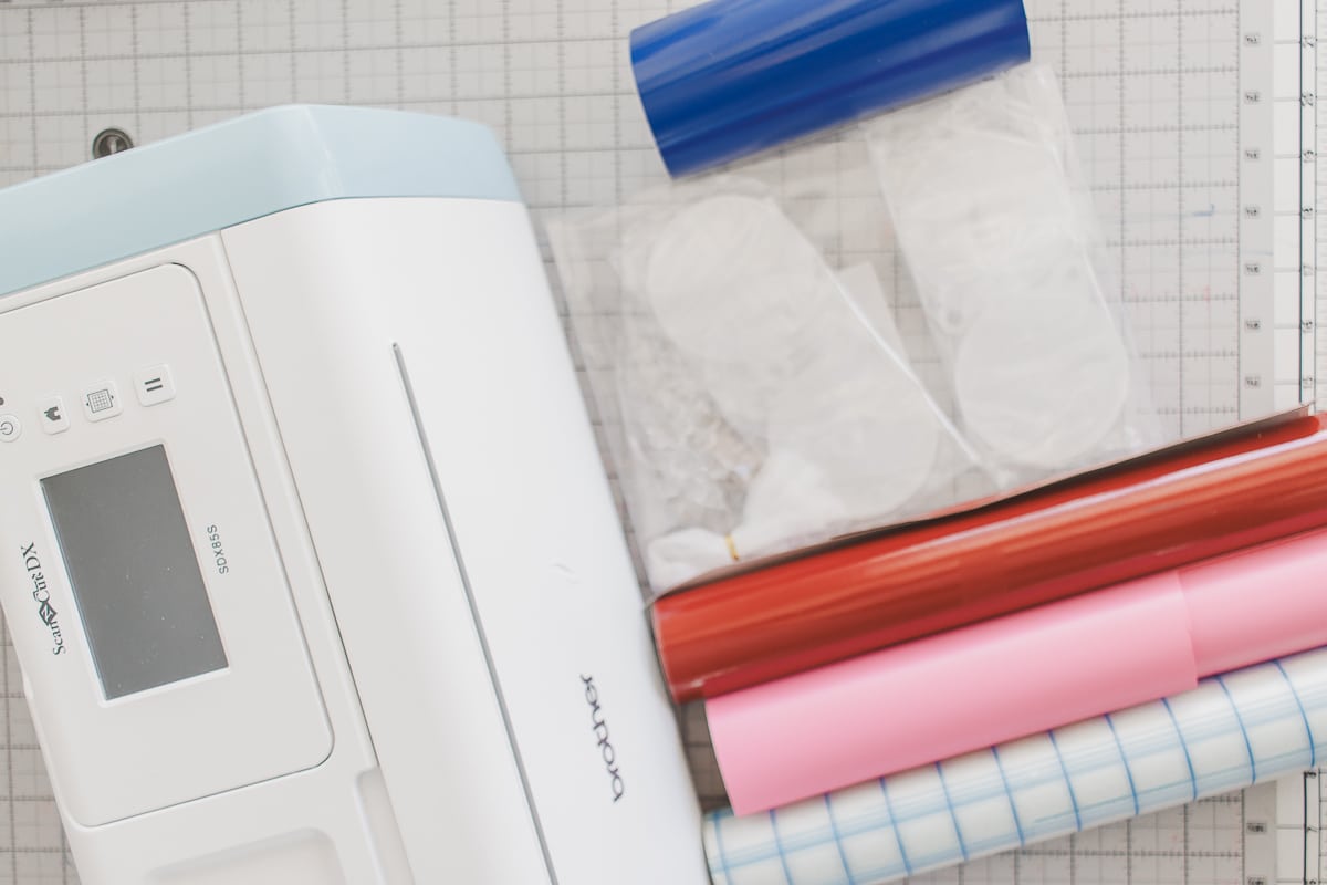 Supplies to make custom ornaments with vinyl and Acrylic discs