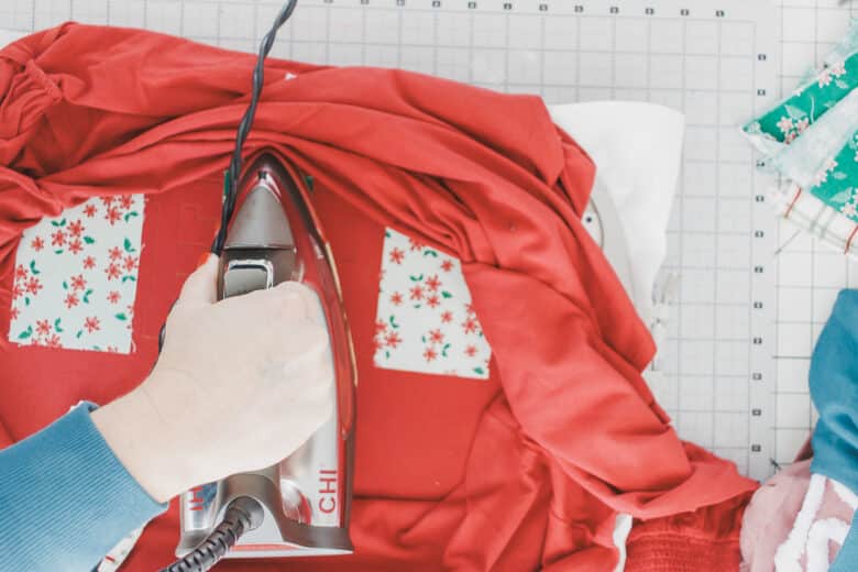 fuse fabric to letter outlines, make sure the fabric doesn't overlap design outlines