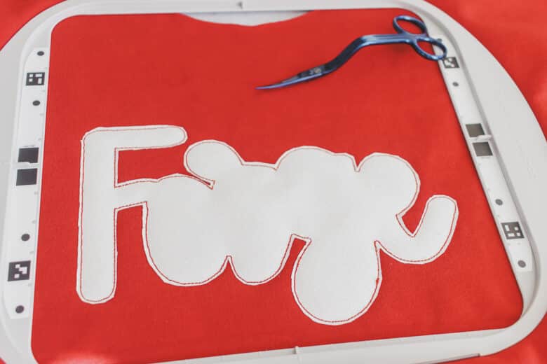 trim canvas with embroidery scissors