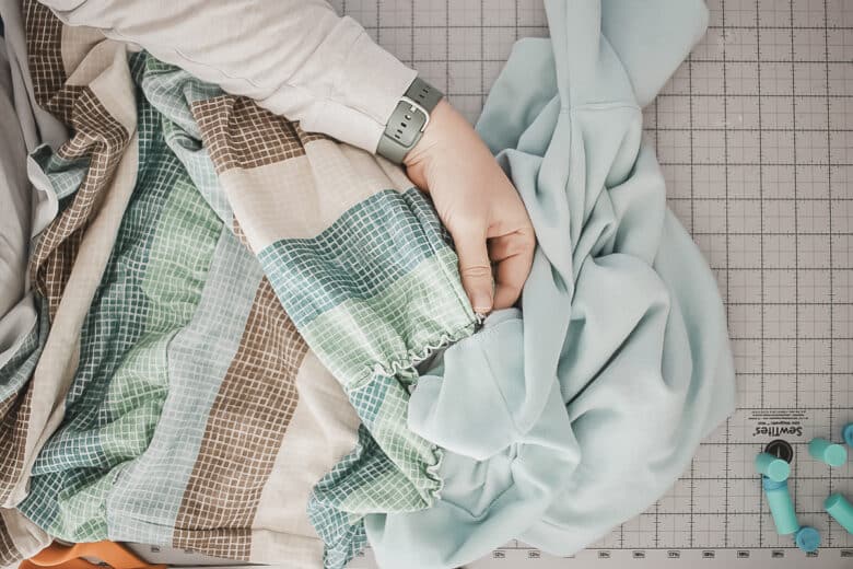 pin top of skirt to the bottom of the sweatshirt