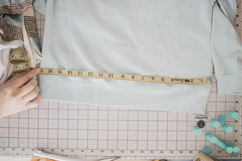 measure the bottom of the sweatshirt
