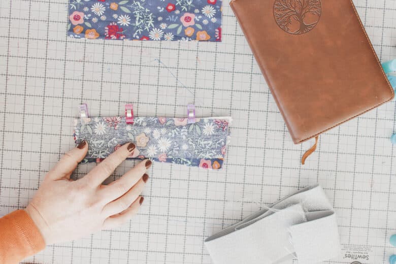 sew one side of the zipper to two pieces of fabric