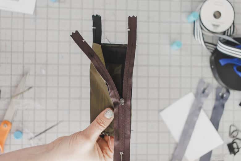 open zipper at least 1/2 way