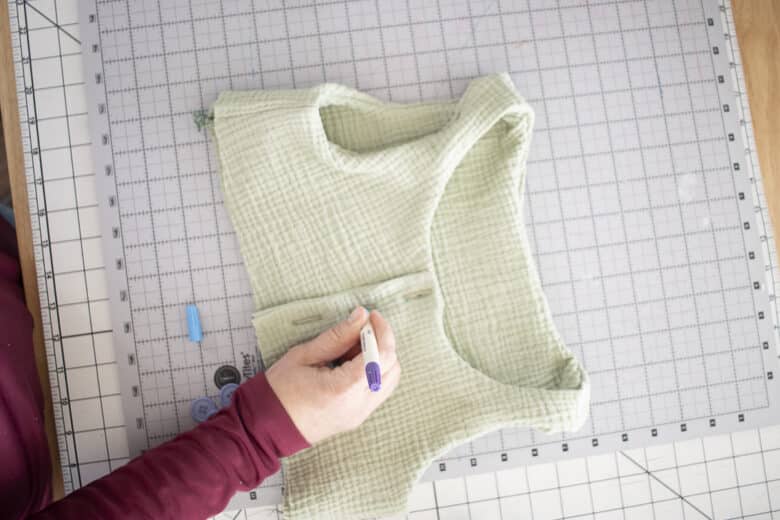 mark through the hole to sew the buttons