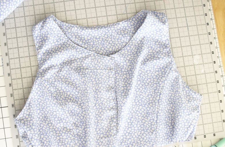 top-stitch neck and arms