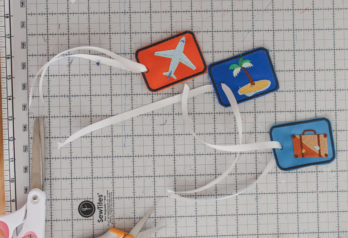 three finished bag tags