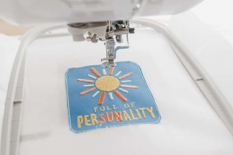 trim fabric, then add satin stitch