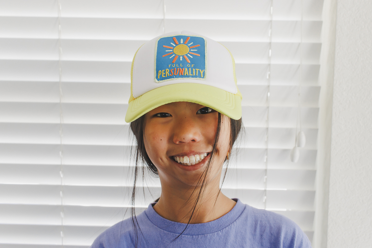 make a custom patch and then sew it on a hat
