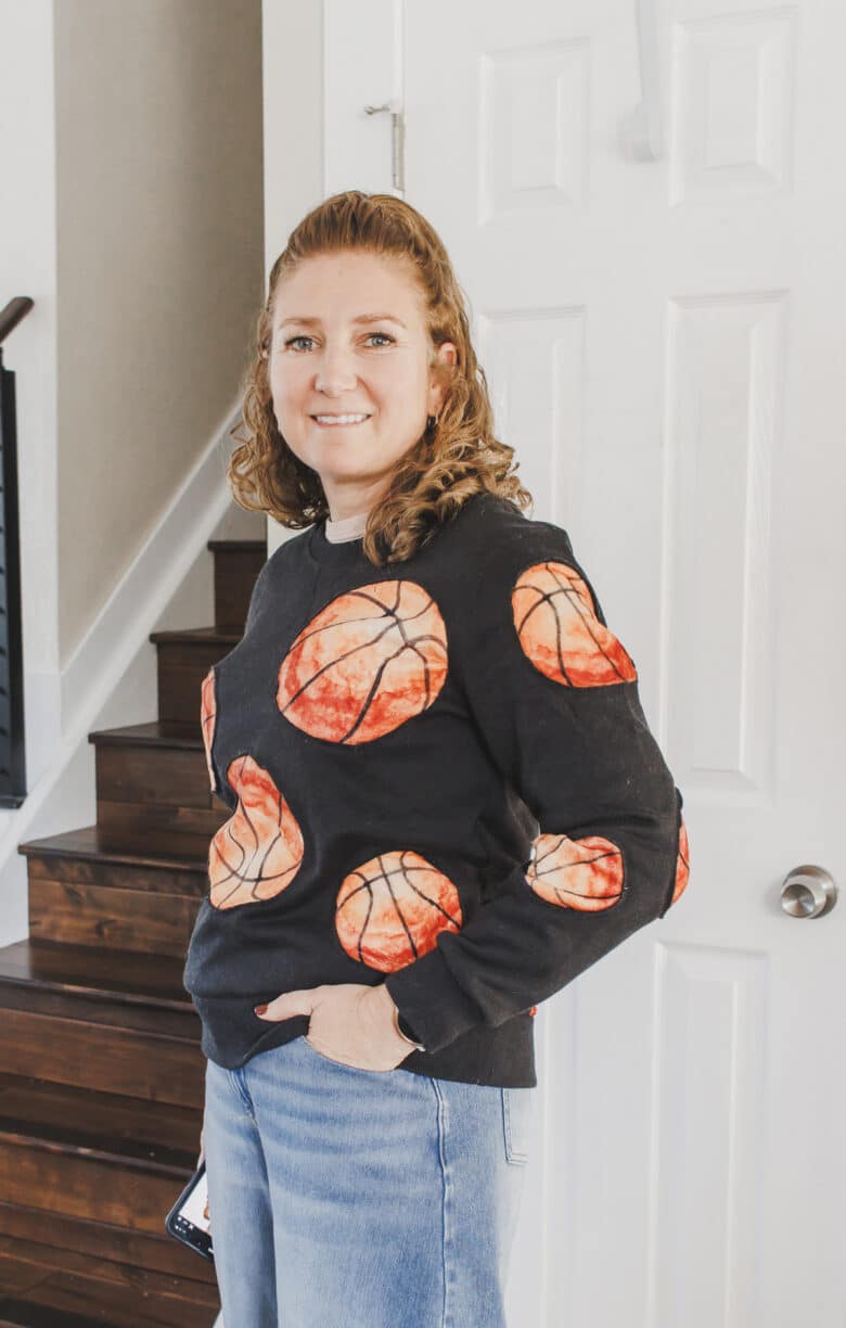 Learn how to create a fun basketball sweatshirt with a mashup of a cozy blanket and  sweatshirt. This Basketball Sweatshirt hack is an easy sewing project. 