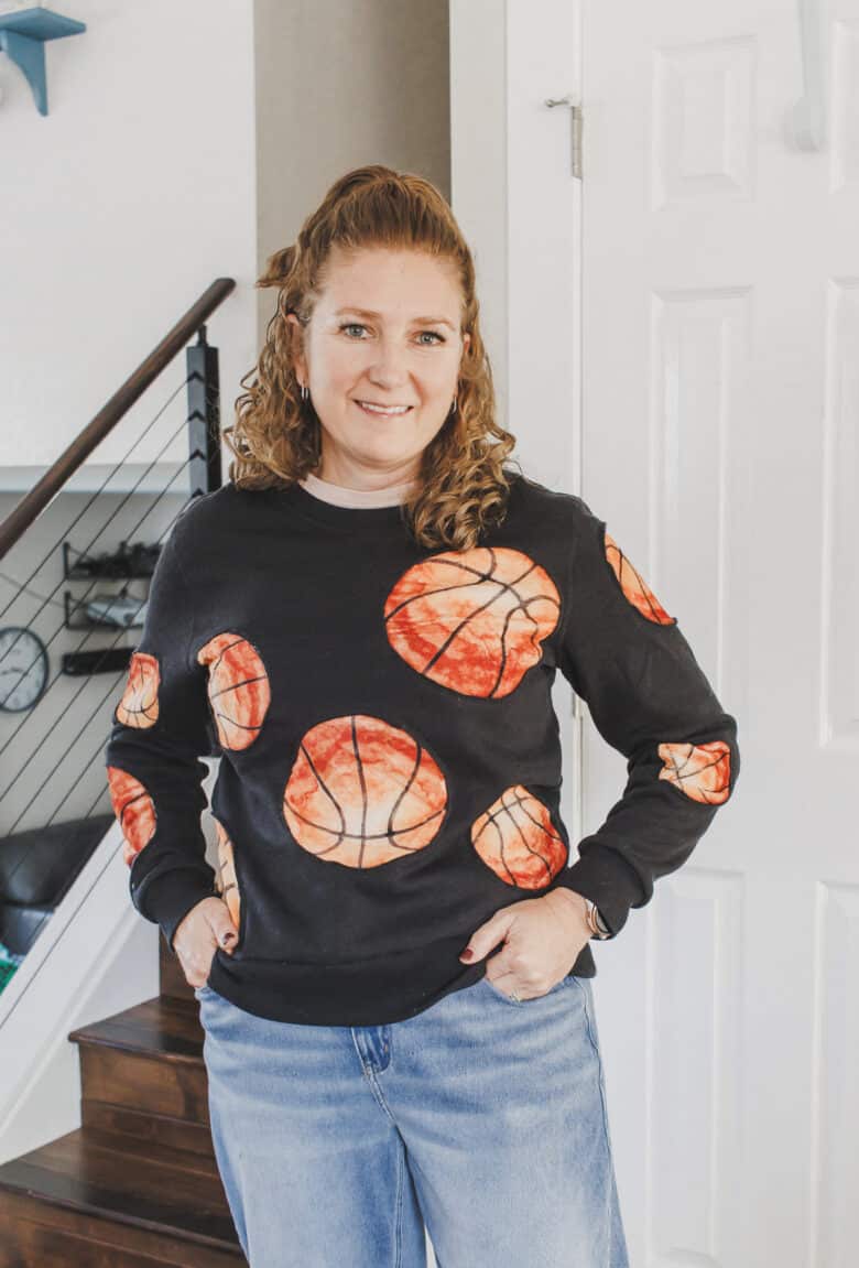 Learn how to create a fun basketball sweatshirt with a mashup of a cozy blanket and  sweatshirt. This Basketball Sweatshirt hack is an easy sewing project. 