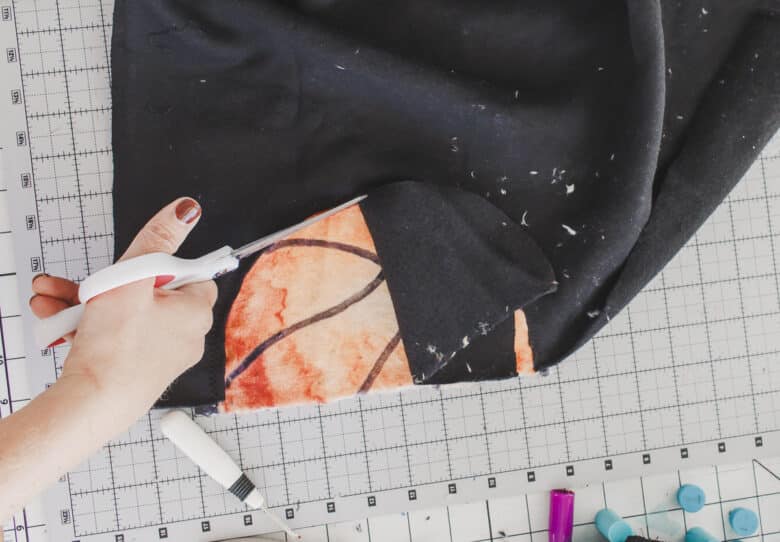 cut fabric to reveal basketball